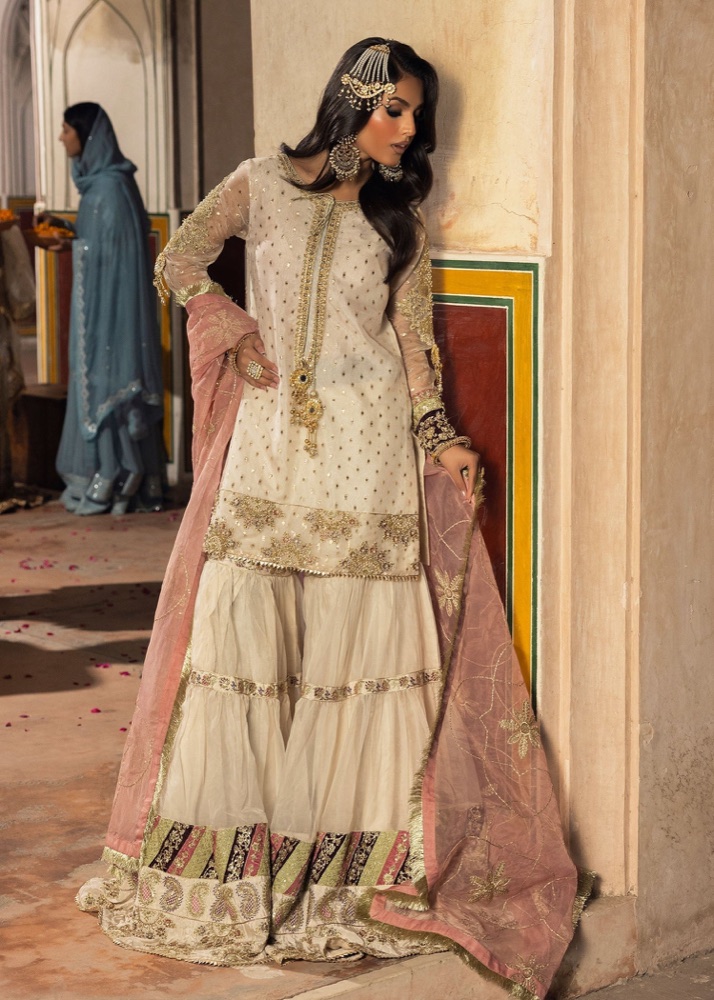 Ivory organza gharara with gold work and a dusty pink dupatta